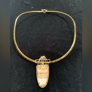 Elegant Gold Necklace with Artistic Pendant